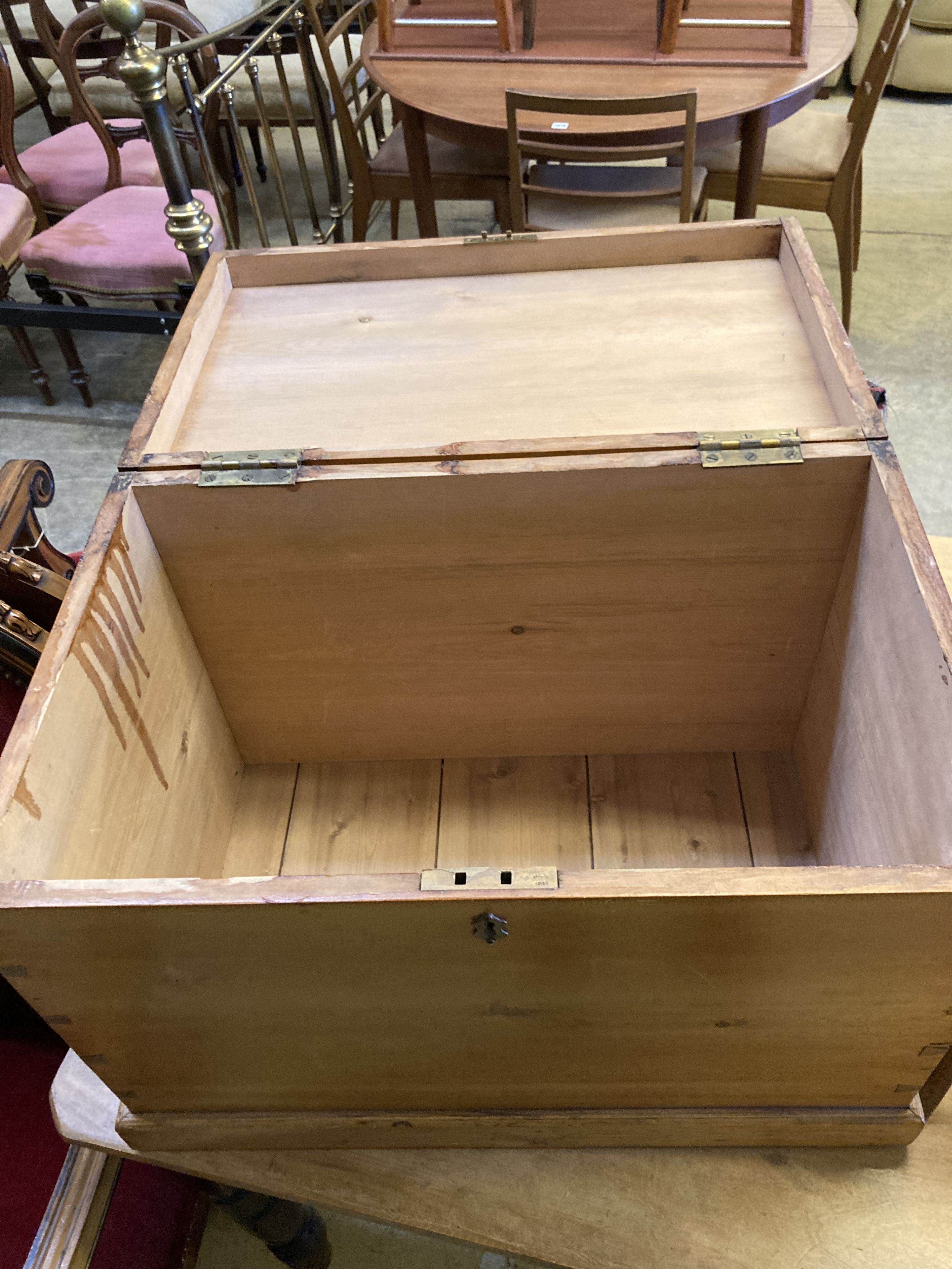 A pine chest with hinged top, width 63cm, depth 40cm, height 44cm together with a folding two-step stool